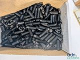 a box full of screws and nuts on a table