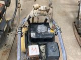 two lawn mowers sitting next to each other on the ground