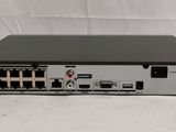 a close up of the front of a black and silver device on a white surface
