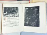 a book open to a picture of a man riding a bike
