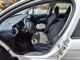the interior of a car with the door open and the driver ' s seat down