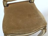 an image of a chair with a brown upholstered seat on a white background