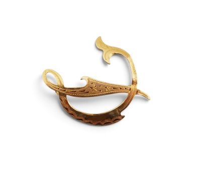 an image of a gold brooch with a fish on it
