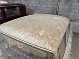a dirty car that is parked in a garage