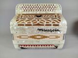 an image of a close up of a white accordion on a table