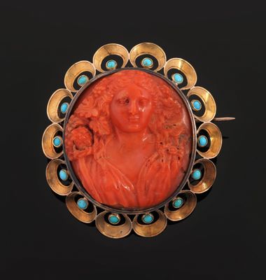 an antique carved coral and turquoise broochee broochle