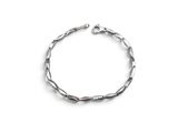 a close up of a silver bracelet on a white background