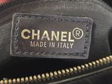a close up of a hand holding a chanel bag