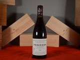 a bottle of wine that is sitting on a table