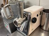 a blender sitting on a kitchen counter next to a pot