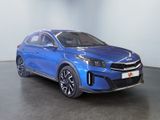 a blue car is parked in a room with a white wall