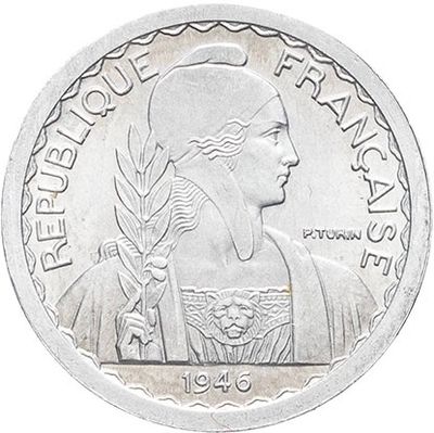 a close up of a coin with a woman on it