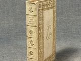 a miniature book that is sitting on a table