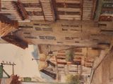 a watercolor painting of a street scene with buildings