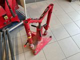 a red machine that is sitting on the floor