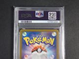 the pokemon card is in a clear plastic holder on a table