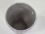 a cup that is sitting on a white table