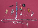 a lot of jewelry that is laying out on a table