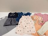 a lot of clothes that are on a table