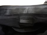 a close up of a black bag with a zipper on it
