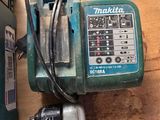a drill and a drillet sitting on a wooden floor