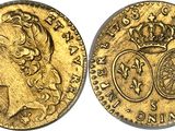 a gold sovereign coin with a crown on top of it