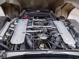 an image of a car engine with the hood open