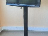 a flat screen tv on a stand in the corner of a room