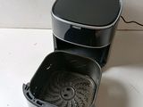 a black and silver coffee maker sitting on a counter