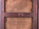 an old wooden box with a wooden handle and a wooden frame