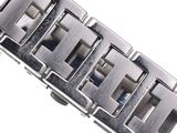 a close up of a watch bracelet on a white surface