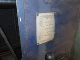 a close up of a blue machine with a sign on it