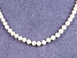 a white pearl necklace on a mannequin mannequin mannequin mannequin mannequin mannequin mannequin mannequin manne