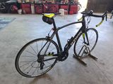 a bike that is sitting on a stand in a garage