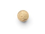 a gold coin on a white surface with a white background
