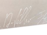 the name of a man is engraved on the side of a business card