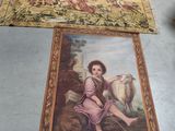 painting on the floor of a room with a painting of a boy and a sheep