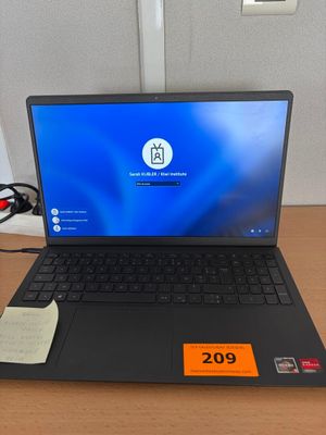 a laptop that is sitting on a desk with a price tag
