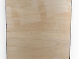 a close up of a piece of wood on a white surface