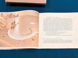 an open book with a picture of a man and a dog on it