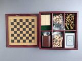 a wooden box with chess pieces in it on the wall
