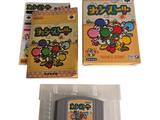 two nintendo game cartridges and a box of nintendo games