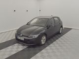 a black car parked in a room with a checkered floor
