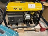 a yellow generator sitting on a pallet in a warehouse