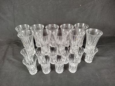 six clear glass vases sitting on top of a black cloth