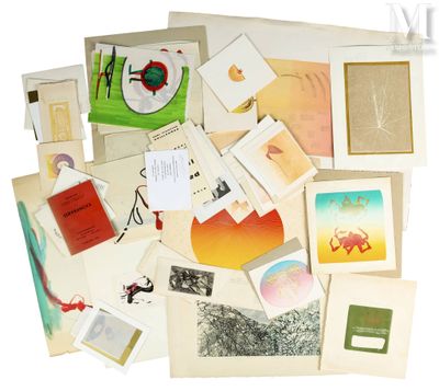 a pile of assorted cards and postcards on a white surface