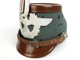 an image of a military hat with a bird on it