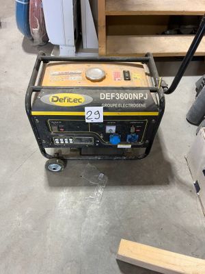 a small generator that is sitting on the floor