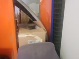 a chair that is sitting on the floor next to a wall