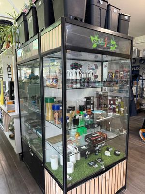 a glass display case with a lot of items inside of it